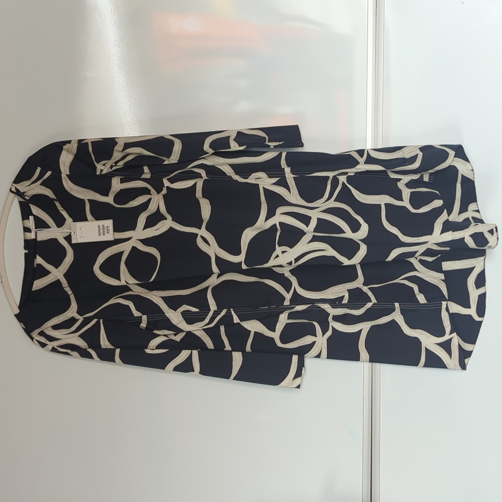 COS Voluminous A-Line Dress with a navy and off-white abstract print